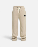 RUVR beige heavyweight fleece sweatpants with a woven label patch and Japanese-script drawstring detail.