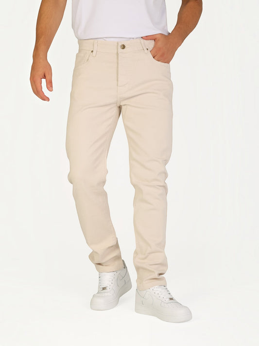 A model wearing RUVR beige heavyweight cotton twill straight-fit jeans with five-pocket construction.