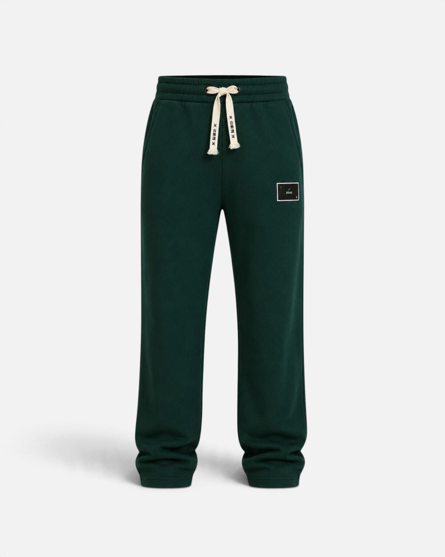 RUVR dark green heavyweight fleece sweatpants with a woven label patch and Japanese-script drawstring detail.