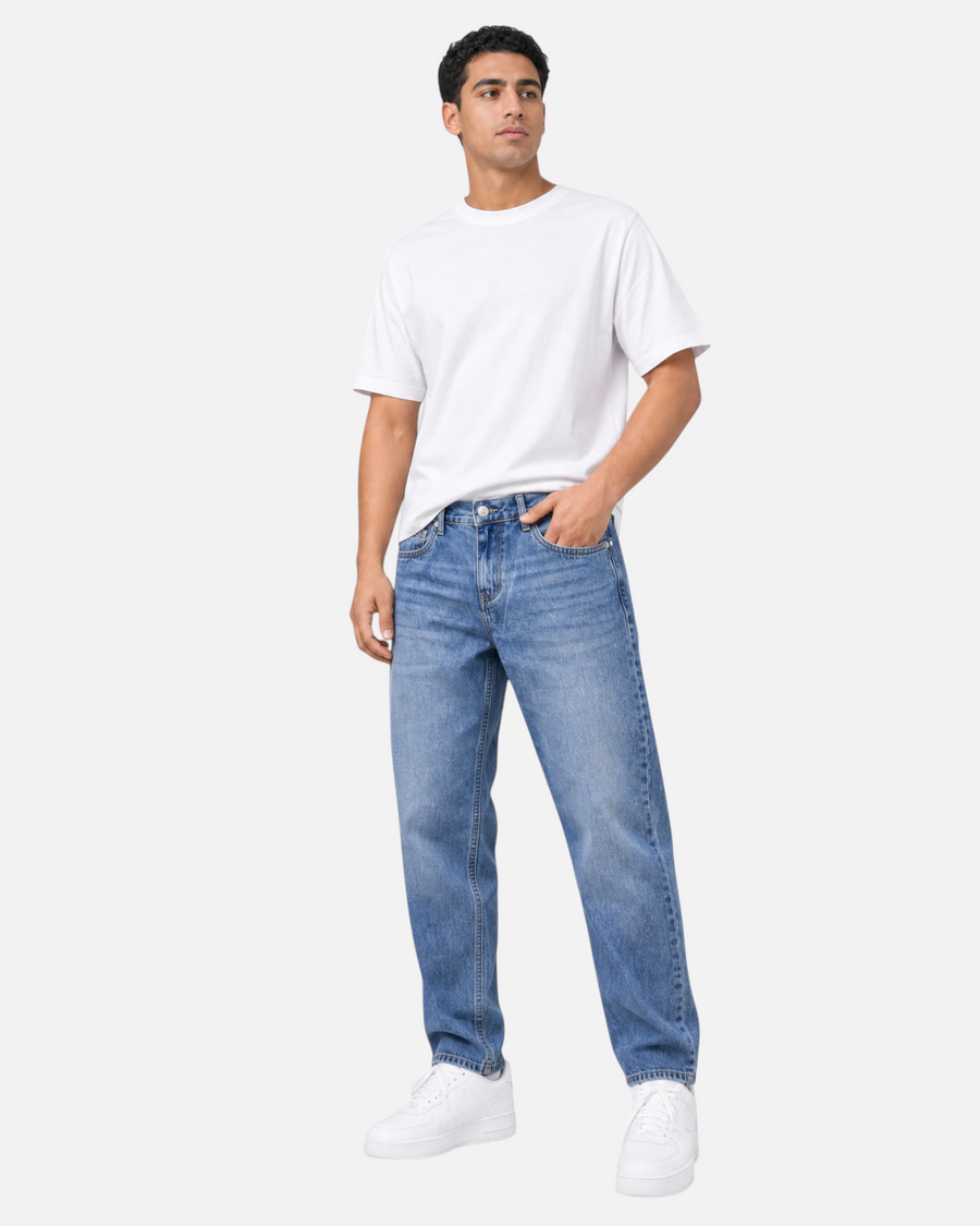 RUVR Ease Relaxed Fit Denim in blue featuring a straight leg, tapered ankle, and classic 5-pocket construction.