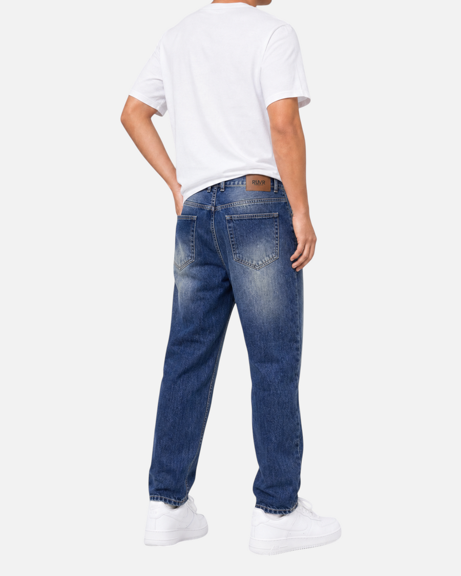 RUVR Ease relaxed fit blue denim jeans with a tapered leg and 5-pocket construction, viewed from the back.