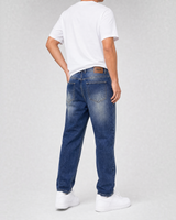 RUVR Ease Relaxed Fit Denim jeans in blue with a straight leg, tapered ankle, and leather back patch.