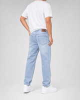 RUVR Ease Relaxed Fit Denim in sky blue with a tapered leg and five-pocket design, viewed from the back.