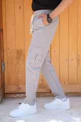 RUVR Field Cargo Pant in light grey with a relaxed wide-leg fit, elasticated drawstring waist, and side cargo pocket.