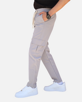 RUVR Field Cargo Pant in light grey with a structured thigh pocket, elasticated waistband, and cream drawstring.