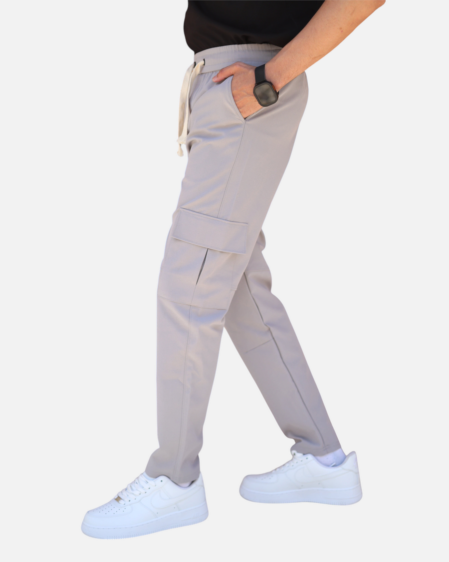 RUVR Field Cargo Pant in light grey with a structured thigh pocket, elasticated waistband, and cream drawstring.