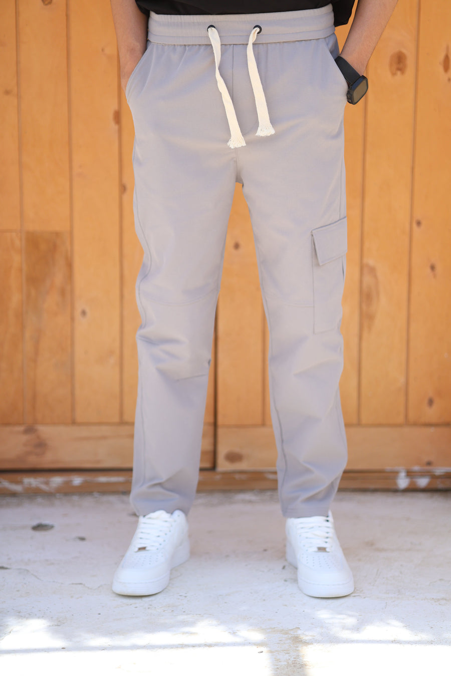 RUVR Field Cargo Pant in light grey with an elasticated waistband, cream drawstring, and structured thigh pocket.