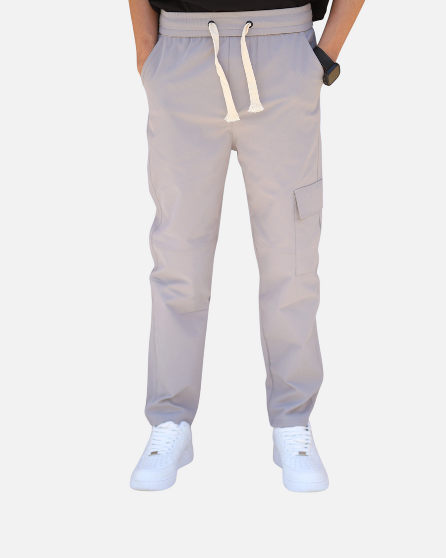 RUVR Field Cargo Pant in light grey with elasticated waistband, cream drawstring, and structured cargo pocket.