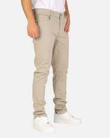 RUVR Grain Denim straight-fit trousers in beige heavyweight cotton twill with five-pocket construction on a model