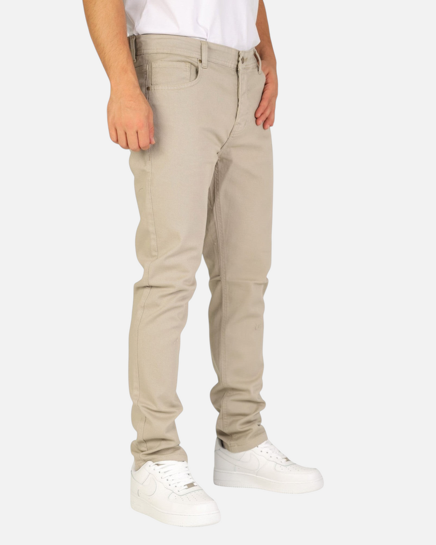 RUVR Grain Denim straight-fit trousers in beige heavyweight cotton twill with five-pocket construction on a model