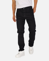 RUVR Grain Denim straight-fit jeans in black heavyweight cotton twill worn by a model with white sneakers.
