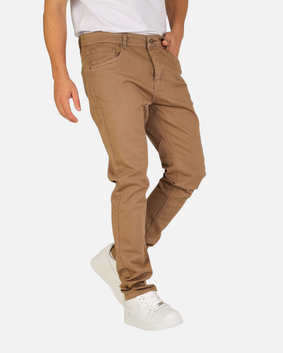Model wearing RUVR Grain Denim straight-fit trousers in brown heavyweight cotton twill with five-pocket construction.
