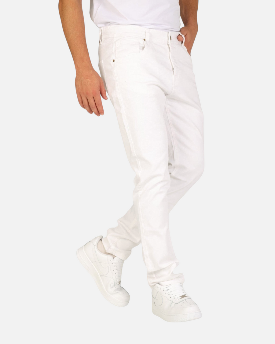 RUVR Grain Denim straight-fit jeans in white heavyweight cotton twill worn by a model with white sneakers