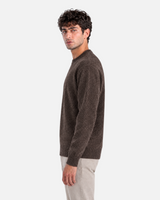 RUVR Grain brown textured knit crew neck pullover worn by a man in a side profile view.