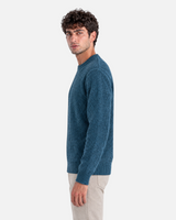RUVR Grain pullover in petrol blue with a textured knit crew neck and clean silhouette worn by a man.