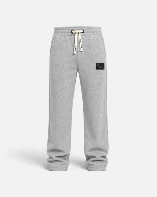 RUVR grey heavyweight fleece sweatpants with a woven label patch and Japanese-script drawstring detail.