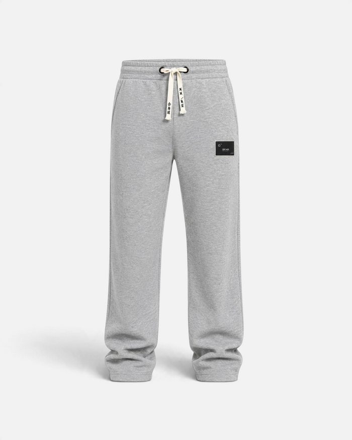 RUVR grey heavyweight fleece sweatpants with a woven label patch and Japanese-script drawstring detail.
