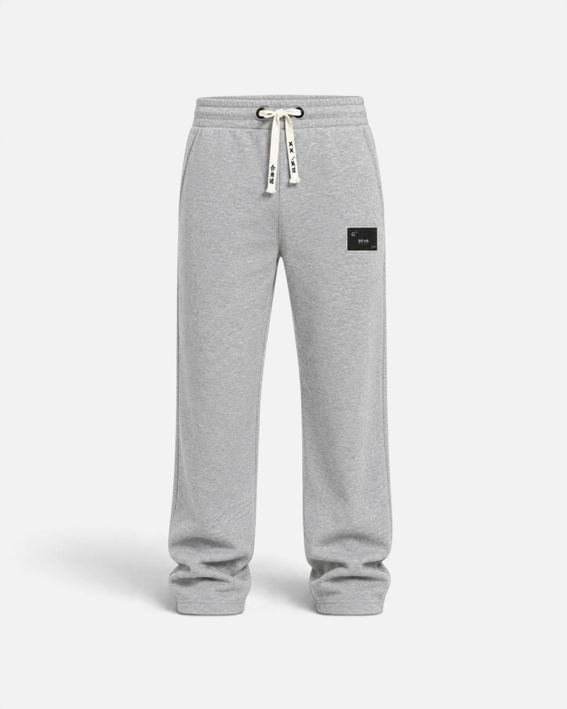 RUVR grey heavyweight fleece sweatpants with a woven label patch and Japanese-script drawstring detail.