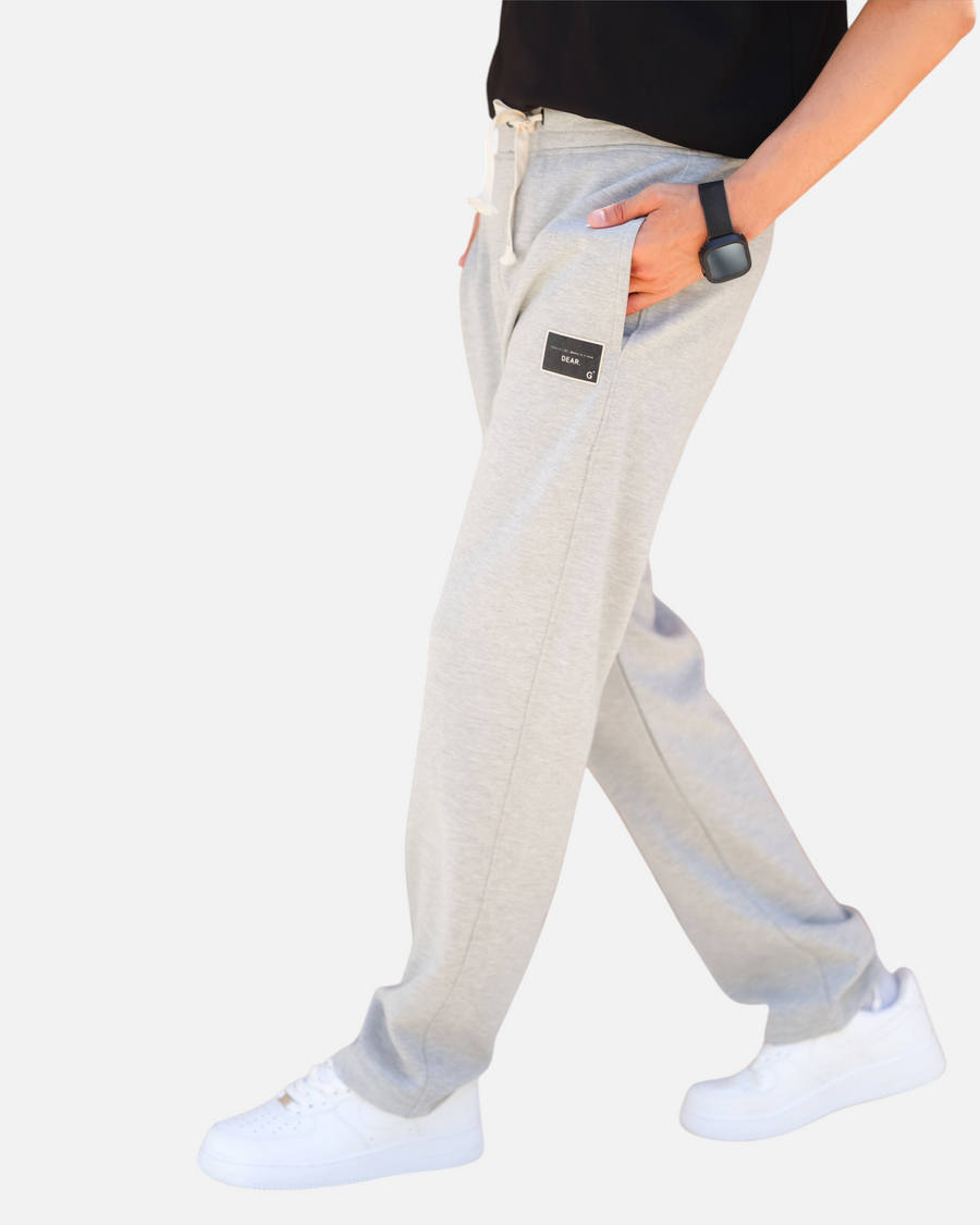 RUVR grey heavyweight fleece sweatpants with a woven label patch on the left thigh and Japanese-script drawstring.