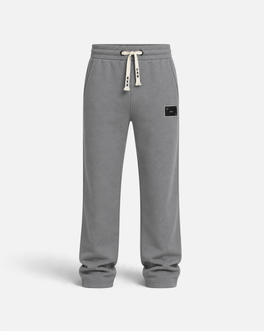 RUVR grey heavyweight fleece sweatpants with a woven label patch, elasticated waistband, and Japanese-script drawstring
