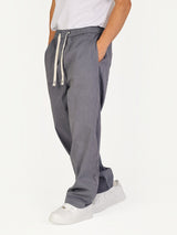 RUVR Urban Utility Pants in grey with an elastic drawstring waistband and relaxed fit worn by a model