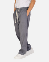 RUVR Urban Utility Pants in grey with an elastic drawstring waistband and relaxed fit worn by a model