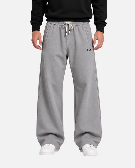 RUVR grey heavyweight wide-leg sweatpants with an elasticated drawstring waist and small logo detail.
