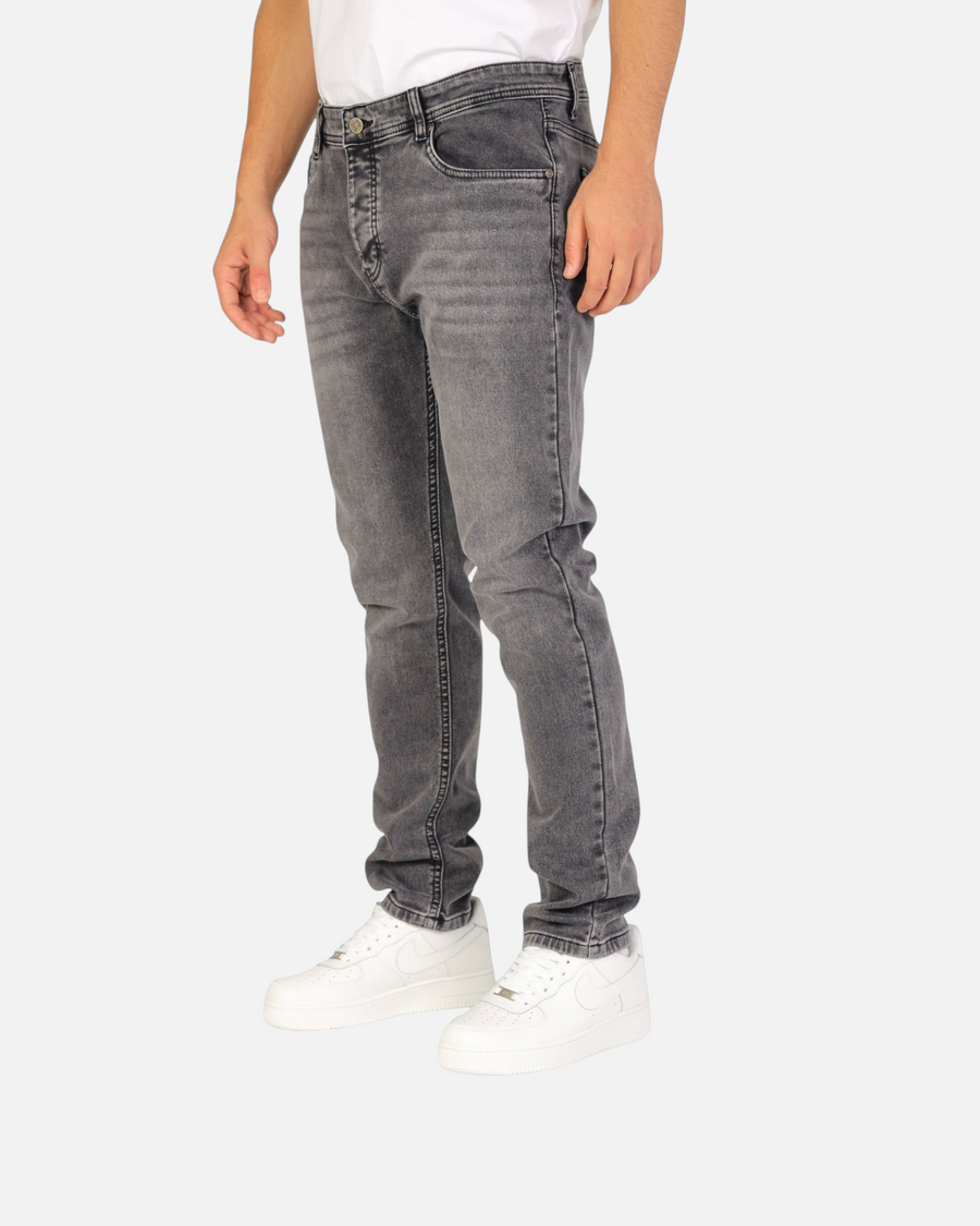 RUVR Haze Denim straight-leg jeans in a grey stonewash finish with five-pocket construction on a male model