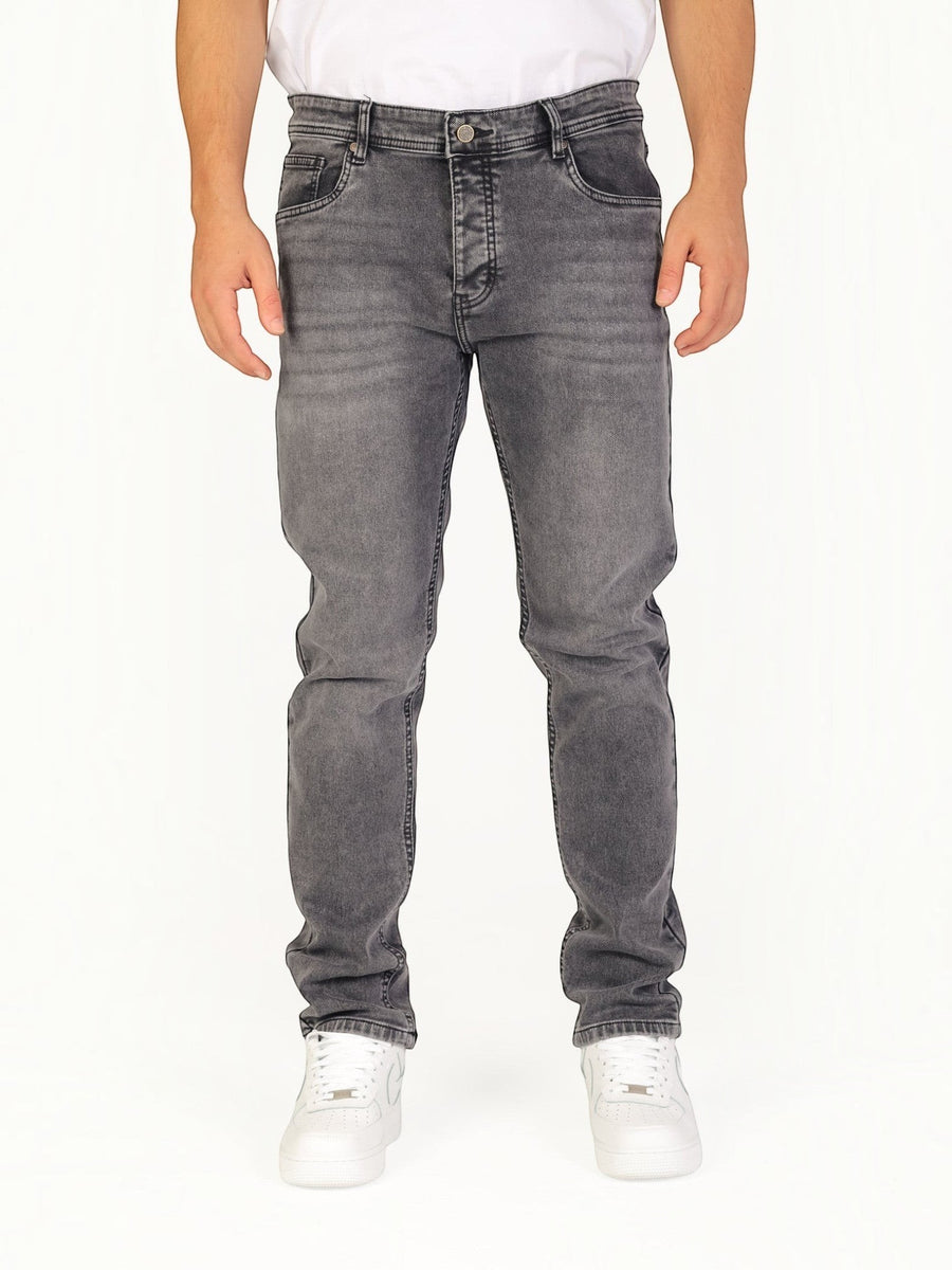 RUVR Haze Denim straight-leg jeans in a grey stonewash finish with five-pocket construction on a model