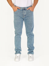 RUVR Haze Denim straight-leg jeans in a light blue stonewash finish with five-pocket construction on a model