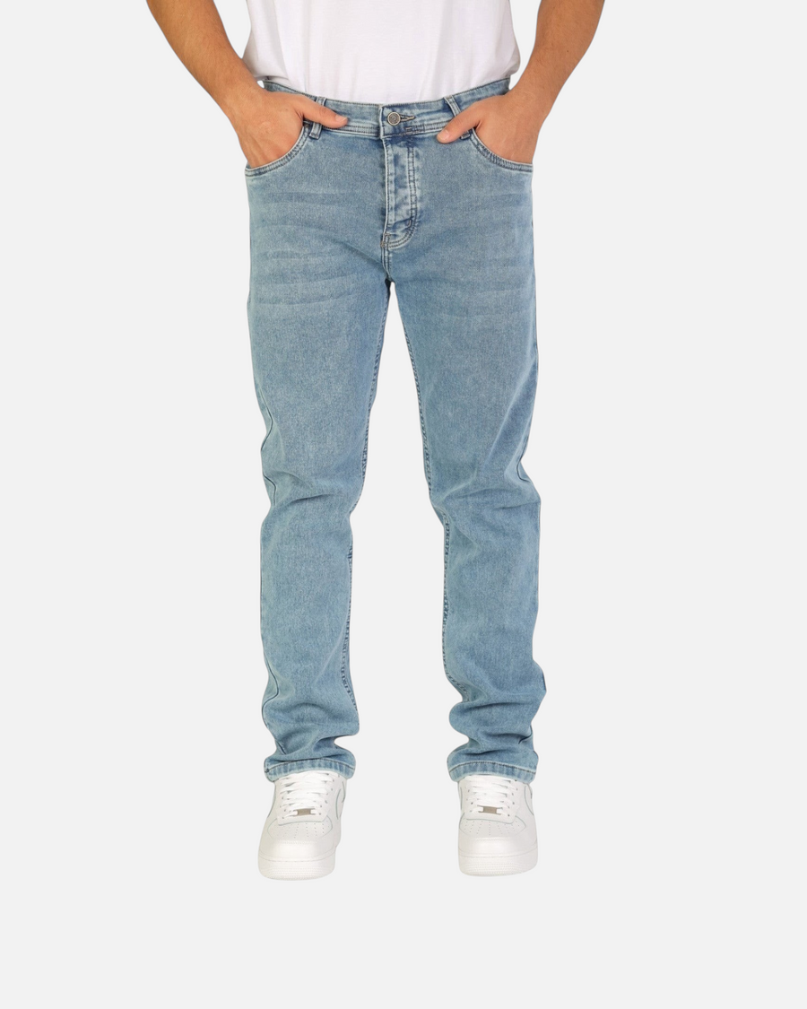 RUVR Haze Denim straight-leg jeans in a light blue stonewash finish with five-pocket construction on a model