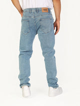 RUVR Haze Denim straight-leg jeans in light stonewash blue cotton with five-pocket styling and leather back patch.