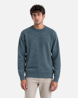 RUVR knit pullover in olive green with a ribbed crew neck, cuffs, and hem worn by a male model.