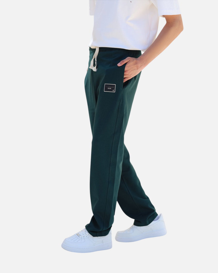 RUVR dark green heavyweight fleece sweatpants with a woven label patch and Japanese-script drawstring detail