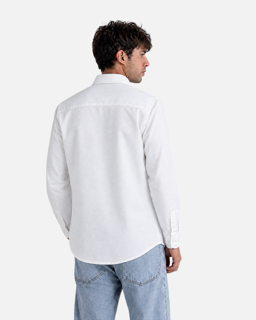 RUVR Press Shirt in white, a structured long-sleeve button-down worn by a man, back view