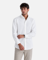 RUVR Press Shirt in white, a tailored long-sleeve button-down with a structured collar worn by a male model.