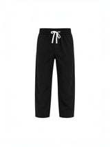 RUVR Urban Utility Pants in black with a relaxed fit, elastic waistband, and white adjustable drawstring.