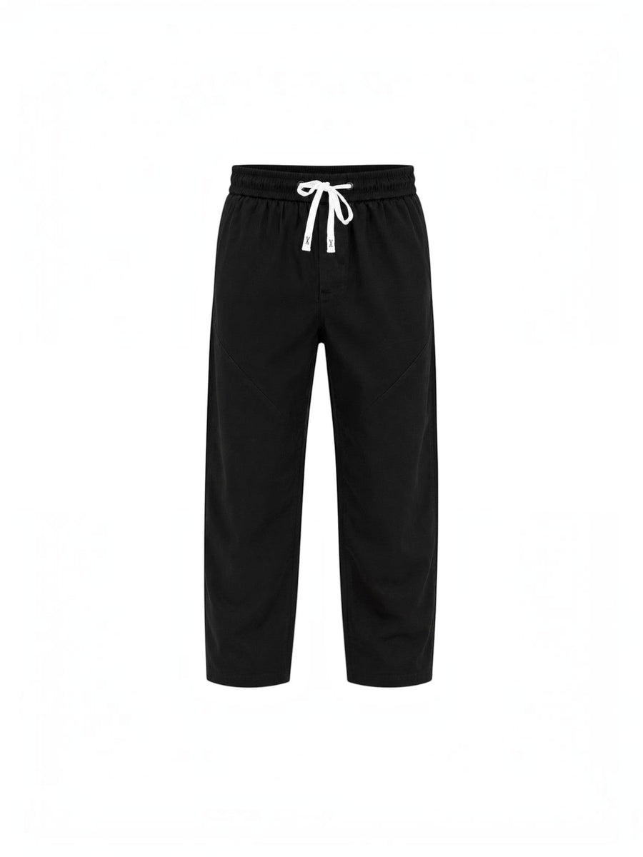 RUVR Urban Utility Pants in black with a relaxed fit, elastic waistband, and white adjustable drawstring.
