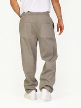 RUVR Urban Utility Pants in grey with an elastic drawstring waistband and relaxed fit, back view on a model.