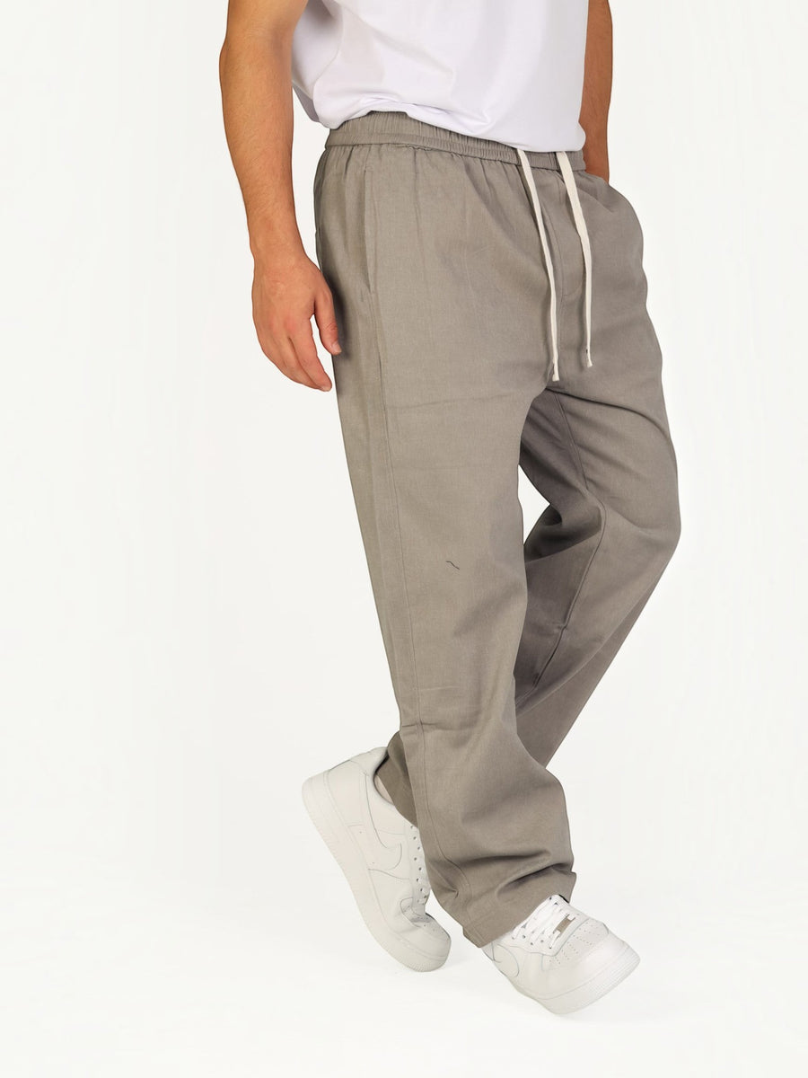 RUVR Urban Utility Pants in grey with an elastic drawstring waistband, worn by a model in a relaxed fit.