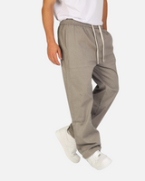 RUVR Urban Utility Pants in grey with an elastic drawstring waistband, worn by a model in a relaxed fit.