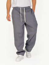 RUVR Urban Utility Pants in grey with an elastic drawstring waistband and a relaxed modern fit on a male model