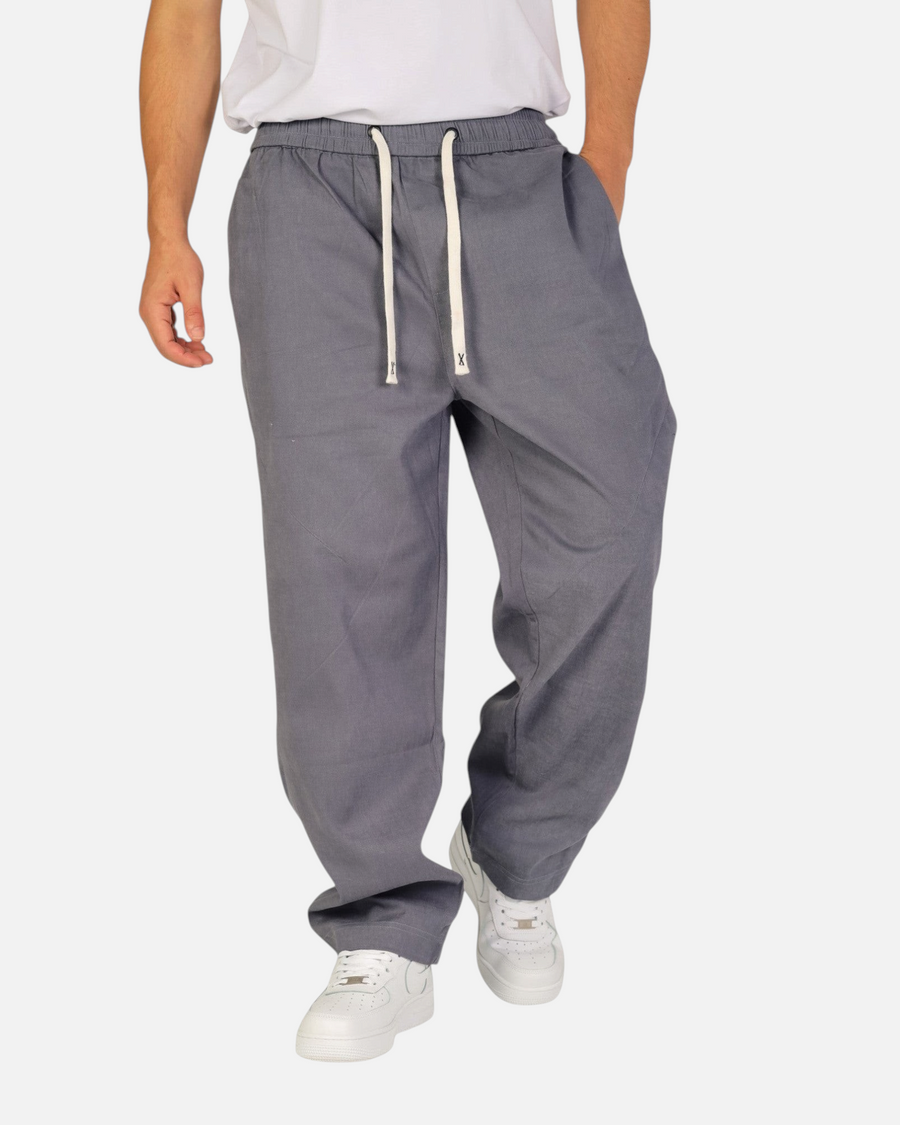RUVR Urban Utility Pants in grey with an elastic drawstring waistband and a relaxed modern fit on a male model