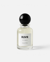 RUVR VYBE Lacoste White 55ml eau de parfum in a clear glass bottle with a round black cap against a white background.